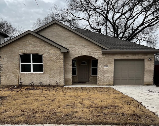 view of front of property with a garage