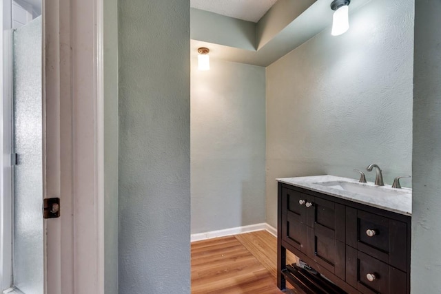 bathroom featuring vanity and hardwood / wood-style floors