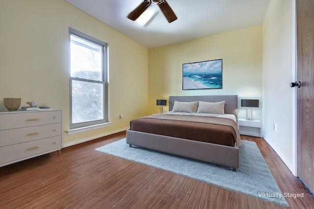 bedroom featuring hardwood / wood-style flooring and ceiling fan