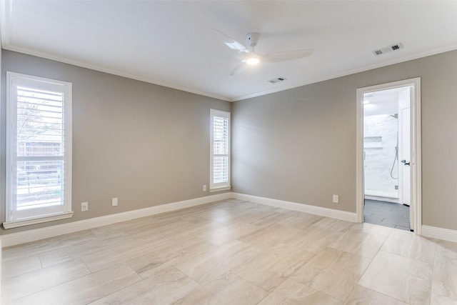 spare room featuring ornamental molding and ceiling fan