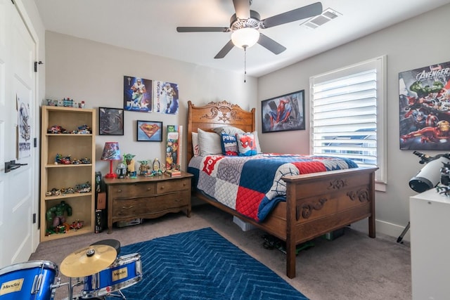 bedroom featuring visible vents, carpet flooring, baseboards, and ceiling fan