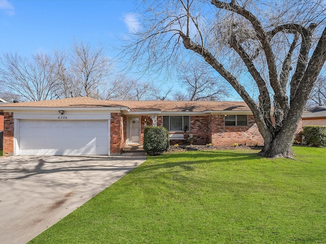 ranch-style home featuring a garage and a front lawn