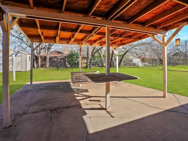 view of patio with a shed