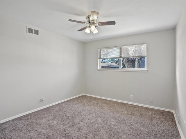 carpeted empty room featuring ceiling fan