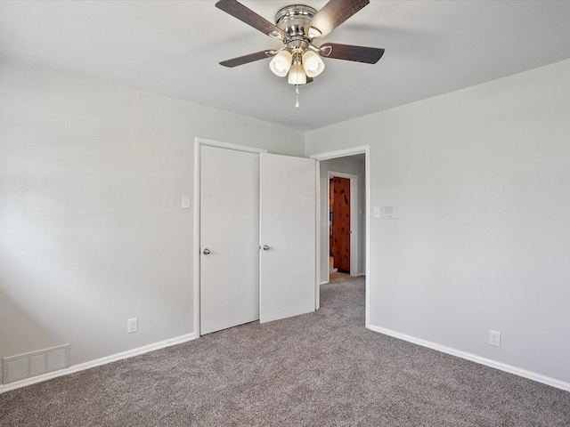 unfurnished bedroom featuring carpet floors and ceiling fan