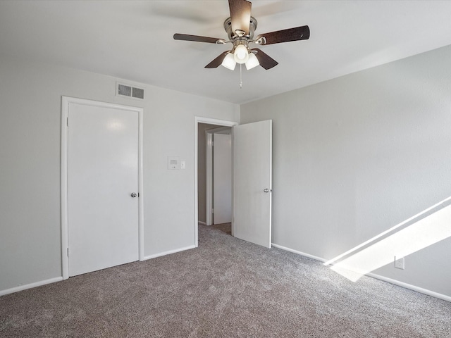 unfurnished bedroom with ceiling fan and carpet flooring