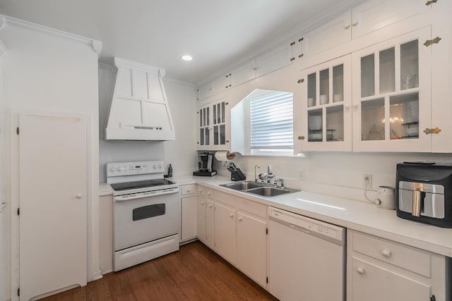 kitchen with sink, white cabinets, dark hardwood / wood-style flooring, custom range hood, and white appliances