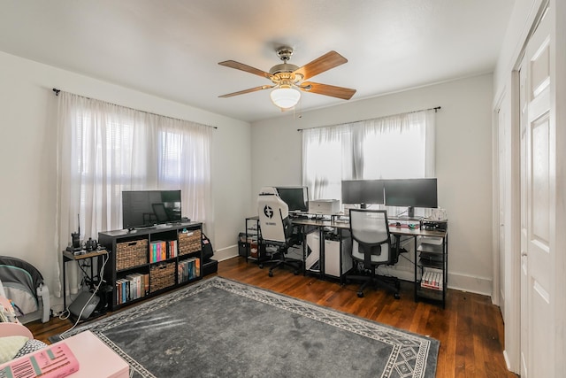 office with dark hardwood / wood-style flooring and ceiling fan