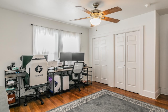 office area with dark hardwood / wood-style flooring and ceiling fan