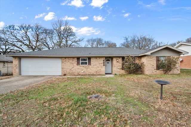 single story home featuring a garage and a front yard