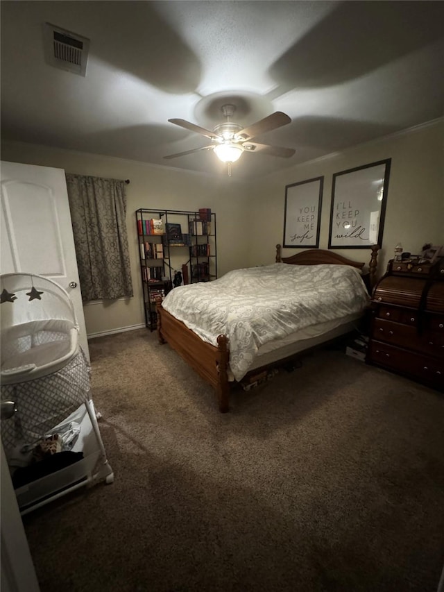 carpeted bedroom with visible vents and a ceiling fan