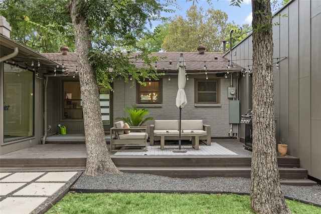 rear view of property featuring outdoor lounge area and a deck