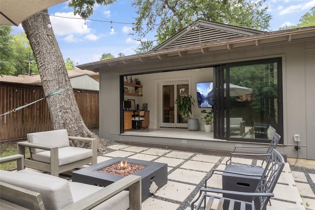 view of patio with a fire pit