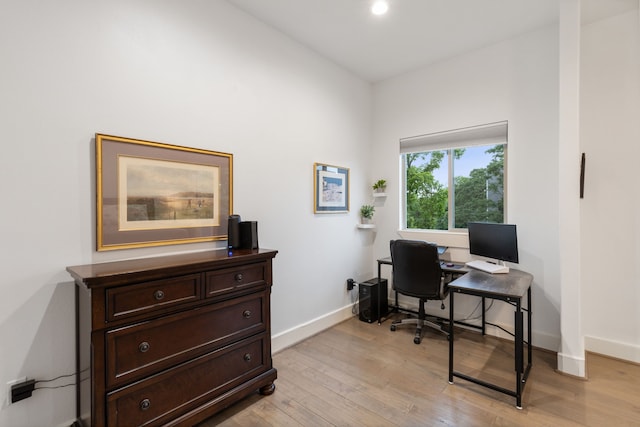 office space with light wood-type flooring