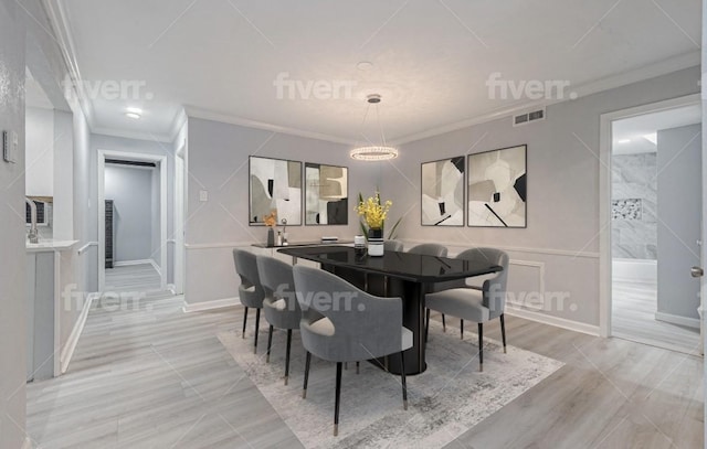 dining space with crown molding