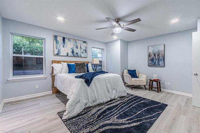 6004 E University Blvd Unit 131, Dallas, TX 75206 - bedroom featuring recessed lighting, baseboards, a ceiling fan, and light wood finished floors