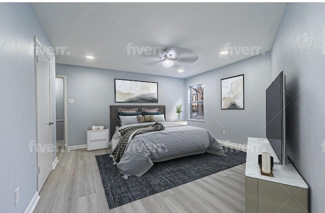 bedroom with ceiling fan and light wood-type flooring