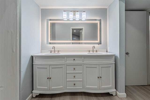 bathroom with vanity and hardwood / wood-style flooring