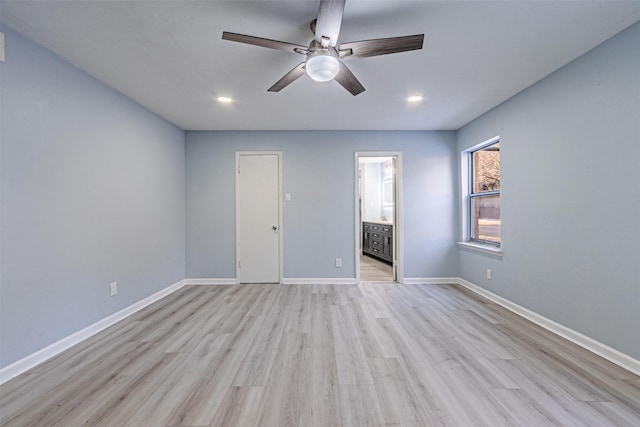 unfurnished bedroom with light hardwood / wood-style flooring, ceiling fan, and ensuite bathroom