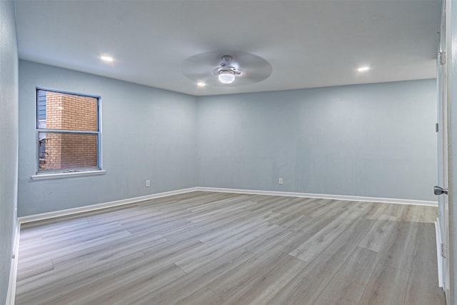 unfurnished room featuring ceiling fan and light hardwood / wood-style flooring