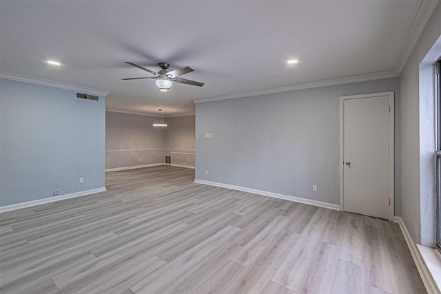 spare room featuring crown molding, ceiling fan, and light hardwood / wood-style flooring