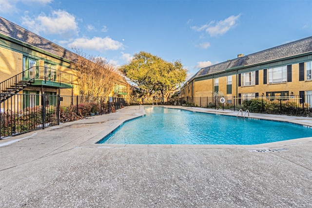 6004 E University Blvd Unit 131, Dallas, TX 75206 - pool featuring fence and a patio