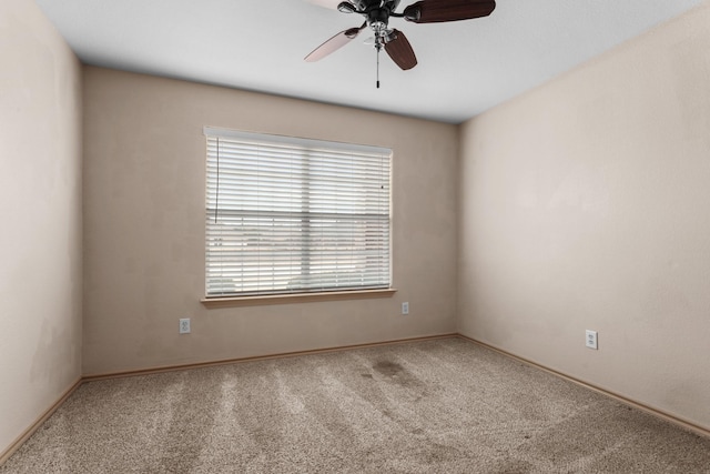 unfurnished room with carpet floors and ceiling fan