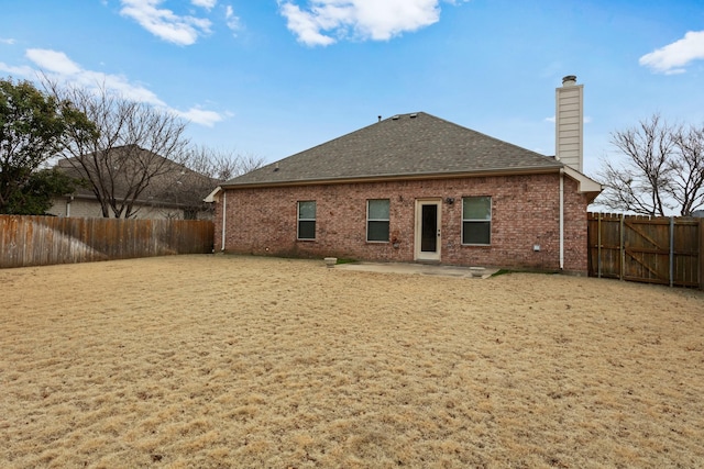 back of property with a patio area