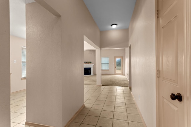 corridor with light tile patterned flooring