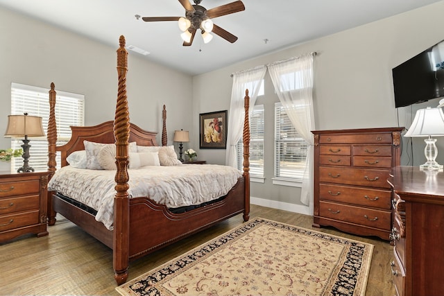 bedroom with ceiling fan and hardwood / wood-style floors