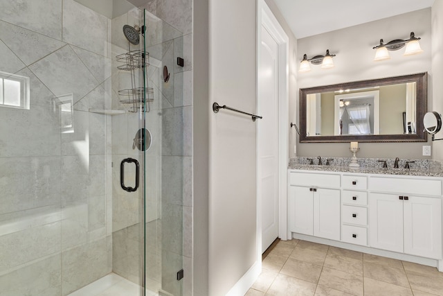 bathroom with vanity and a shower with door