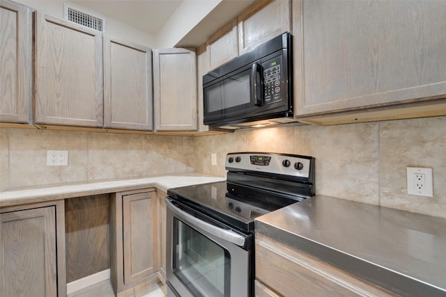 kitchen with tasteful backsplash, stainless steel range with electric cooktop, and light brown cabinetry