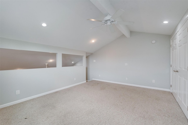 basement featuring light carpet and ceiling fan