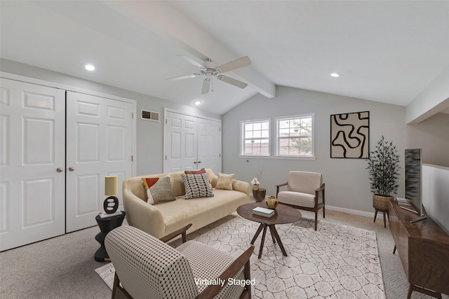 carpeted living room with ceiling fan and vaulted ceiling with beams