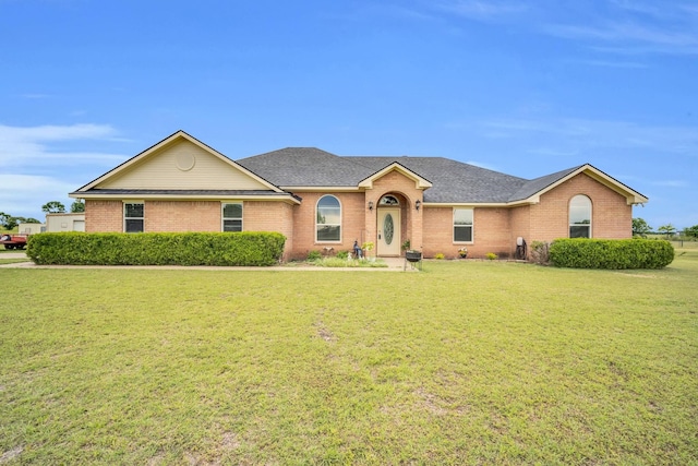 ranch-style home featuring a front yard