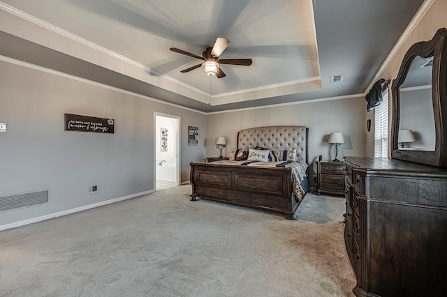 bedroom featuring crown molding, light colored carpet, a raised ceiling, and ceiling fan