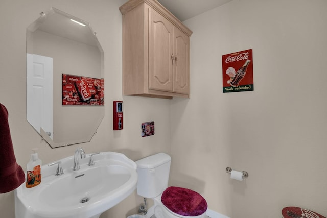 bathroom with sink and toilet