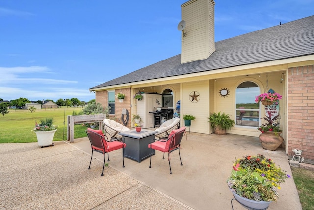 view of patio with a fire pit