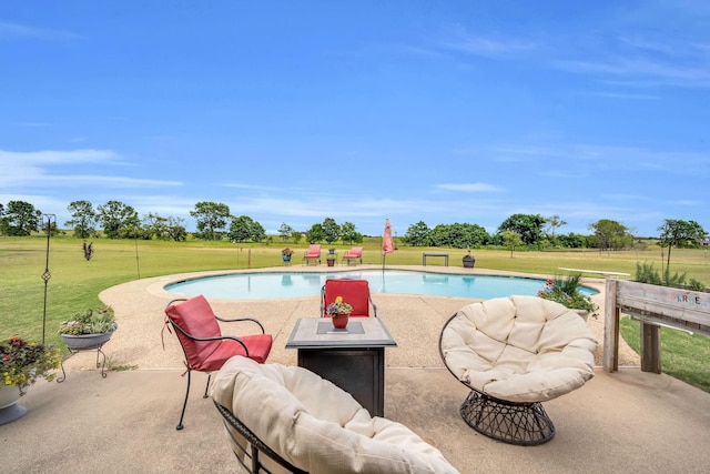 view of pool featuring a patio and a lawn