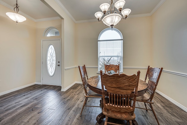 dining space with plenty of natural light, ornamental molding, and dark hardwood / wood-style floors