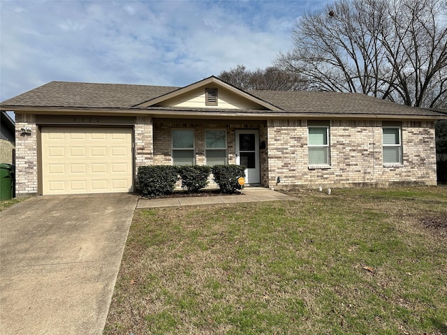 ranch-style home featuring a front yard, brick siding, an attached garage, and roof with shingles