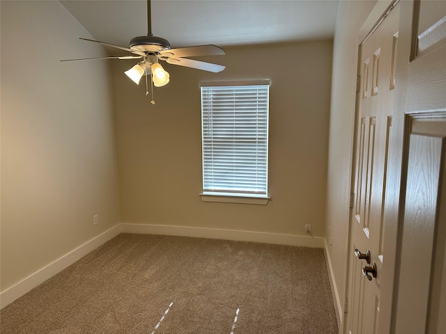 carpeted empty room featuring ceiling fan