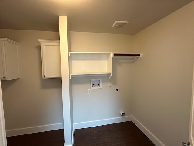 laundry room featuring gas dryer hookup, dark hardwood / wood-style flooring, cabinets, washer hookup, and hookup for an electric dryer