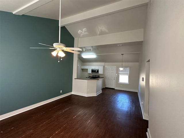 unfurnished living room featuring dark wood-type flooring, vaulted ceiling with beams, and ceiling fan