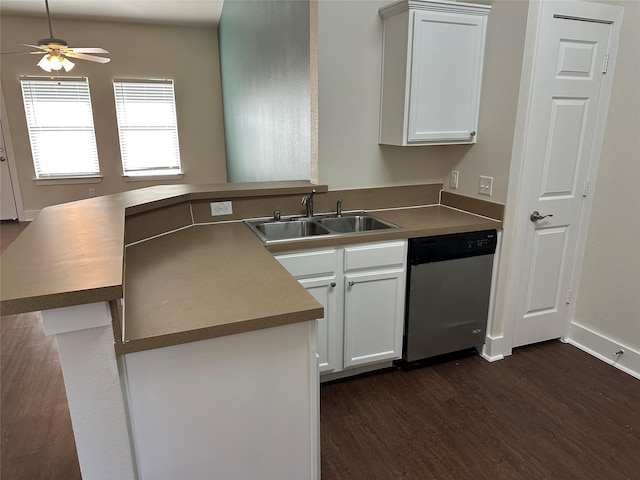 kitchen featuring dishwasher, sink, kitchen peninsula, and white cabinets