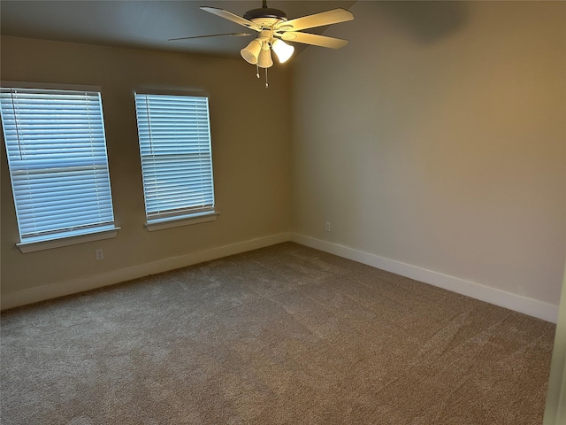 unfurnished room featuring ceiling fan and carpet flooring