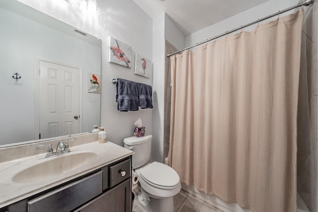 full bathroom with vanity, tile patterned floors, shower / bath combination with curtain, and toilet