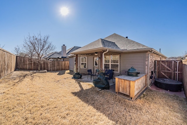 back of property with a patio