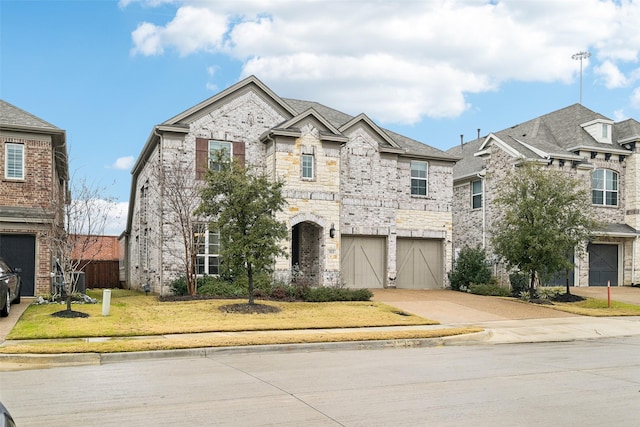 view of front of property featuring a garage and a front yard