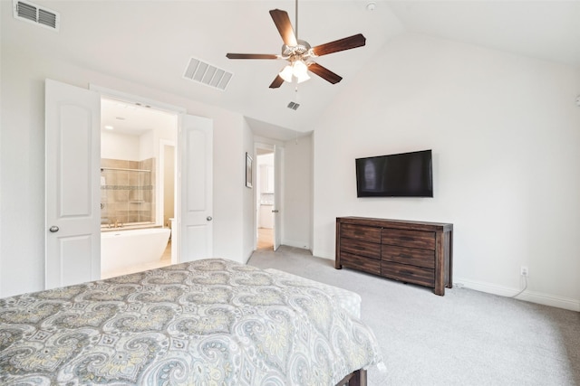 bedroom with ensuite bathroom, lofted ceiling, light colored carpet, and ceiling fan